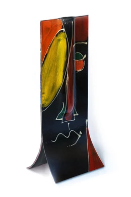 Glass vase made using the burn-in technique in a black and yellow color scheme reminiscent of a cubist face, 14x36 cm