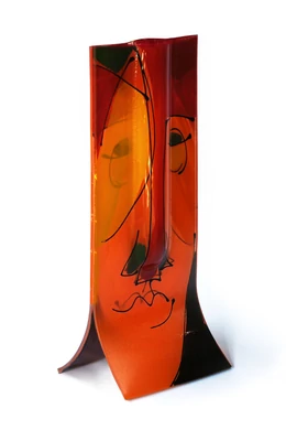Glass vase made using the burn-in technique in an orange and black color scheme reminiscent of a cubist face, 14x36 cm