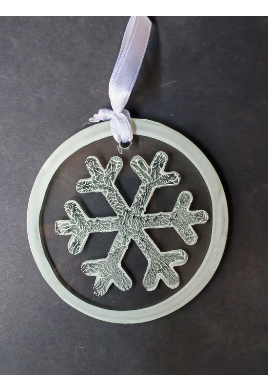 White hand-painted snowflake-shaped glass ornament