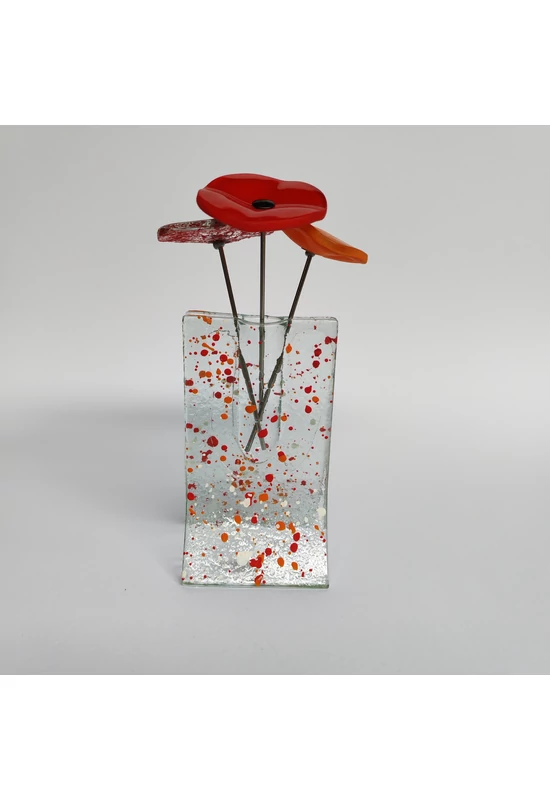 Small transparent 8x13 cm red-orange-white spotty vase with 3 small flowers
